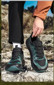 Close-up of breathable mesh texture and non-slip thick sole on outdoor running shoes