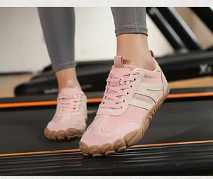 Detail of pink barefoot sports shoe with breathable mesh and anti-slip rubber sole