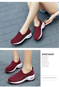 Detail of burgundy mesh sneakers showing breathable knit fabric and air cushion sole