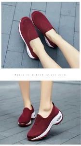 Detail of red mesh walking shoes featuring breathable knit upper and air cushion sole