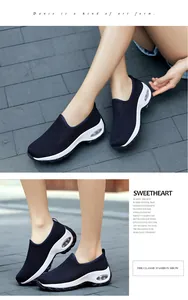 Detail view of breathable navy blue mesh fabric and cushioning air unit on walking shoes