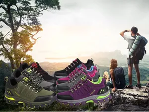 Detail of high-top hiking shoes showing reinforced toes and rugged non-slip rubber soles