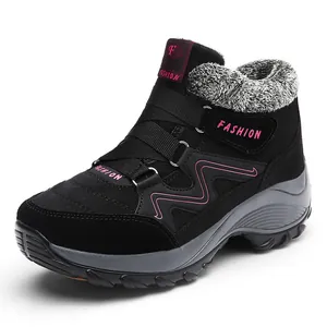 Women's black winter snow boots with pink accents and warm faux fur lining