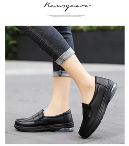 On-foot view of black slip-on nurses shoes with cushioned air sole in street setting