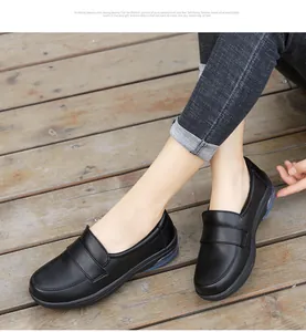 Close-up of black leather loafer with visible blue air cushion unit for comfort