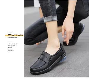 Detail of white women's work shoes with air cushion sole and slip-on design