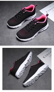 Dettaglio scarpe da corsa in mesh traspirante con suola ammortizzata e accenti rossi