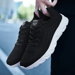 Detailed macro of breathable black mesh fabric and wave-patterned thick sole on a sport sneaker