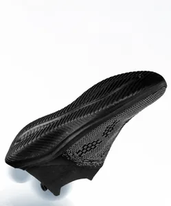 Detail view of MD anti-slip wear-resistant outsole on black flyknit sneakers