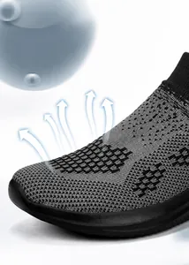 Detail view of breathable grey fly-knit upper showing mesh texture and airflow vents