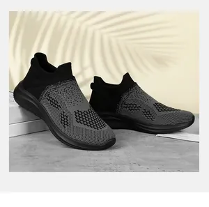 Macro view of breathable knit running shoes with textured grey woven pattern and thick sole