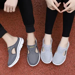 Close-up of breathable mesh mule sneakers with thick soles and SPORT lettering detail