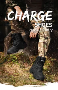 Top view of black tactical boots with anti-slip rubber soles on rocky outdoor terrain