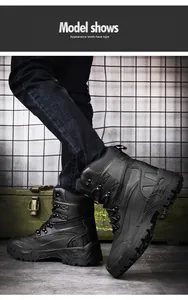 Detail of black tactical boots featuring heavy-duty rubber soles and metal eyelets