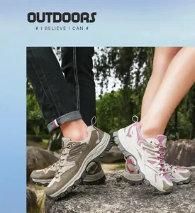 Detail of couple's breathable hiking shoes with anti-slip soles in outdoor forest setting