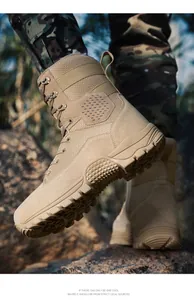 Close-up of khaki tactical boots with breathable mesh and rugged rubber sole in outdoor use