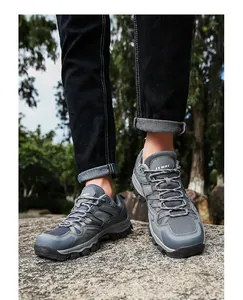 Macro detail of breathable mesh and durable toe cap on gray outdoor hiking shoes