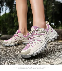 Outdoor hiking shoes with breathable mesh and anti-slip sole on natural stone path
