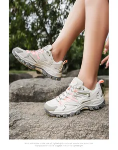 Detail of lightweight breathable hiking shoes with anti-slip EVA sole on rocky terrain