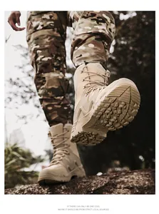 Low-angle shot of sand tactical boots with anti-slip soles and durable leather