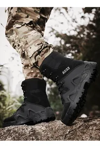 Detail of durable black tactical boots with reinforced toe and deep tread rubber sole
