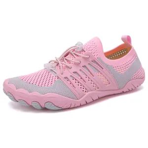 Detail of pink and gray quick-dry water shoes with breathable mesh and toggle lacing system