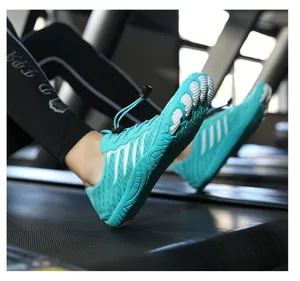 Detail of blue barefoot water shoes on a treadmill showing the five-toe non-slip rubber sole