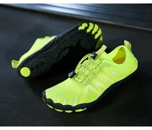 Macro detail of breathable honeycomb mesh and toggle lacing on neon water shoes