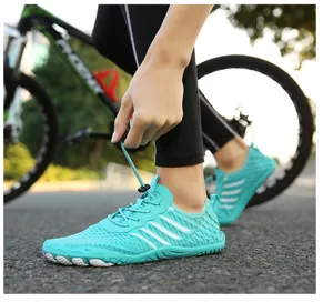 Outdoor close-up of quick-dry water shoe with drawstring laces and mesh design