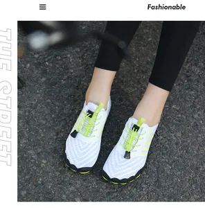 Breathable mesh outdoor water shoes with quick-lace system on dark asphalt surface