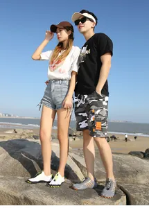 Outdoor summer beach scene showing quick-dry water shoes with casual athletic wear
