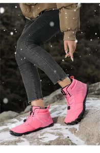 Pink high-top winter snow boot with waterproof fabric and non-slip rubber sole