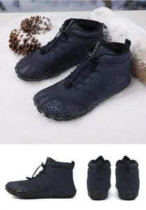 Detail of navy blue winter snow boots featuring warm faux fur lining and bungee laces