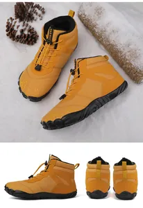 Macro view of bright yellow winter snow boots with thick faux fur lining and non-slip sole