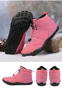 Detail of pink winter snow boots with drawstring laces and thick non-slip rubber sole