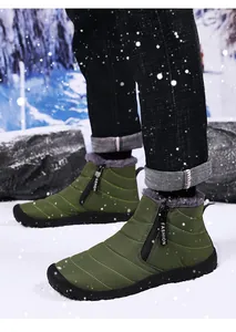 Detail of warm quilted fabric upper and inner faux fur lining of men's snow boots
