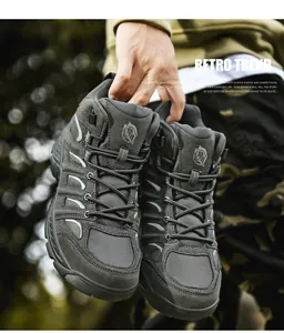 Detailed macro view of charcoal grey suede and breathable mesh hiking shoe texture