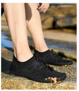 Close-up of quick-dry water shoes with elastic laces and camouflage rubber outsole
