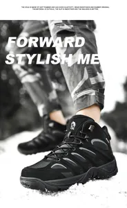 Detail of durable black outdoor hiking boot with soft rubber sole on snow background