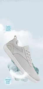 Detail of lightweight grey breathable mesh outdoor training shoe on blue sky background