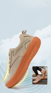 Detail showing high flexibility with 180-degree bendable orange sole of barefoot shoe