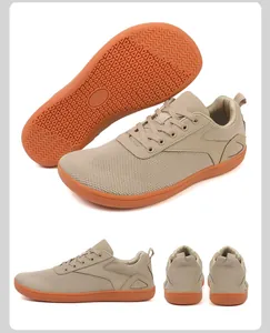 Detailed views of khaki barefoot hiking shoes with breathable mesh and grippy orange rubber soles