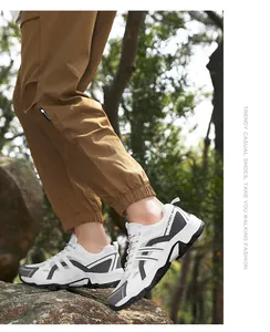Outdoor hiking shoe with breathable mesh and sport lettering on a natural woodland trail