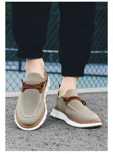 Close-up of khaki breathable knit slip-on loafers with durable non-slip thick white soles