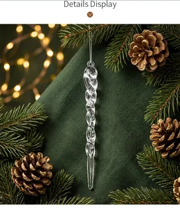Detailed macro view of a clear spiral icicle ornament on a festive Christmas tree branch