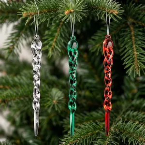 Close-up of clear, red and green acrylic spiral icicle ornaments on a Christmas tree