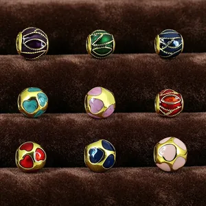Detailed grid showing nine colorful enamel patterns on stainless steel beads for DIY jewelry