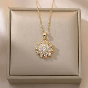 Elegant gold sunflower necklace with clear cubic zirconia in a jewelry gift box
