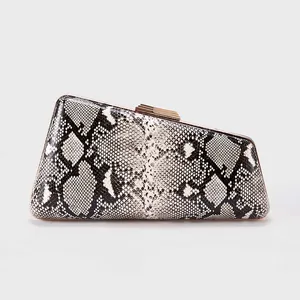 Detail of snake print pattern on geometric evening clutch with gold metal frame
