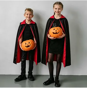 Detail of red stand-up collar and black fabric on Halloween vampire cloak for kids